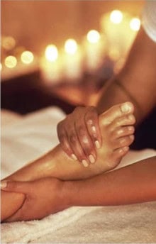 A therapist performing a foot massage